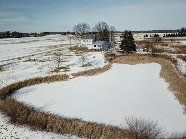 snowy aerial view with a rural view