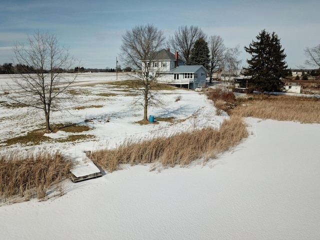 view of yard layered in snow