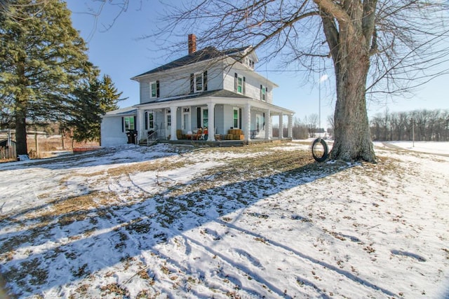 farmhouse featuring covered porch