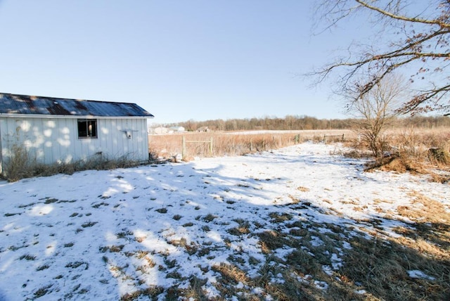 view of yard layered in snow