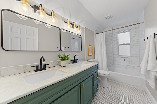 full bathroom featuring tile patterned flooring, vanity, toilet, and shower / bath combo