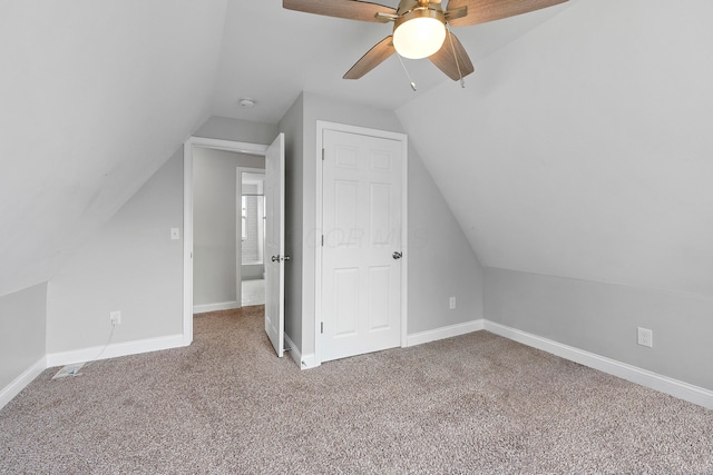 bonus room featuring lofted ceiling, ceiling fan, and carpet flooring