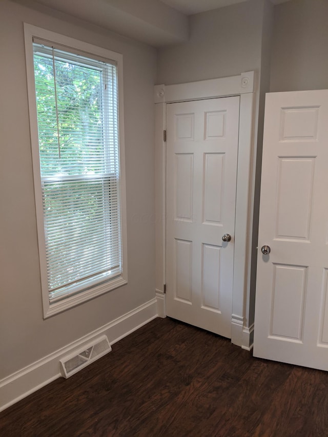 interior space with dark wood-type flooring