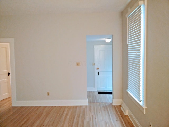 spare room featuring light wood-type flooring