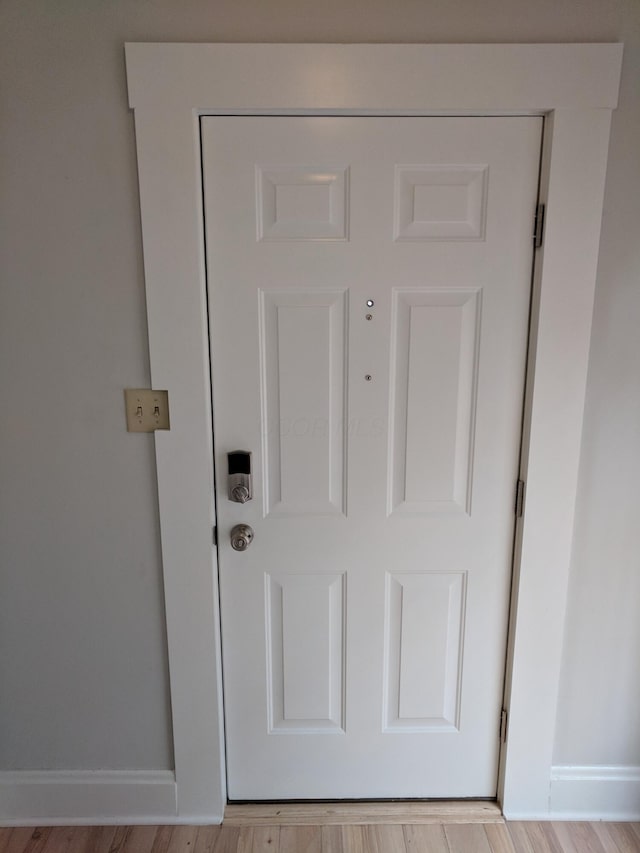 interior details featuring hardwood / wood-style flooring