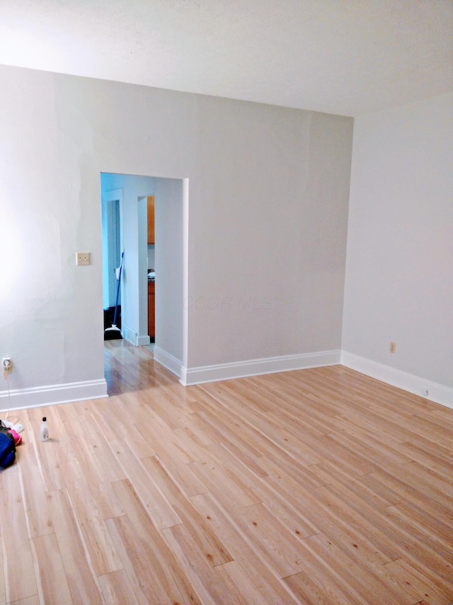 unfurnished room with light hardwood / wood-style flooring