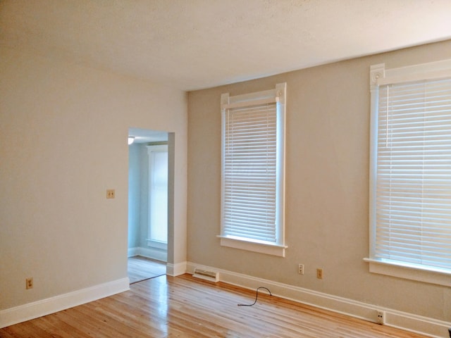 unfurnished room featuring light hardwood / wood-style flooring