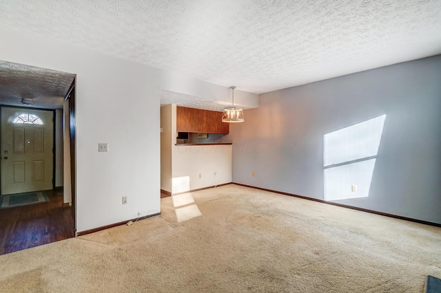 interior space featuring a textured ceiling and carpet