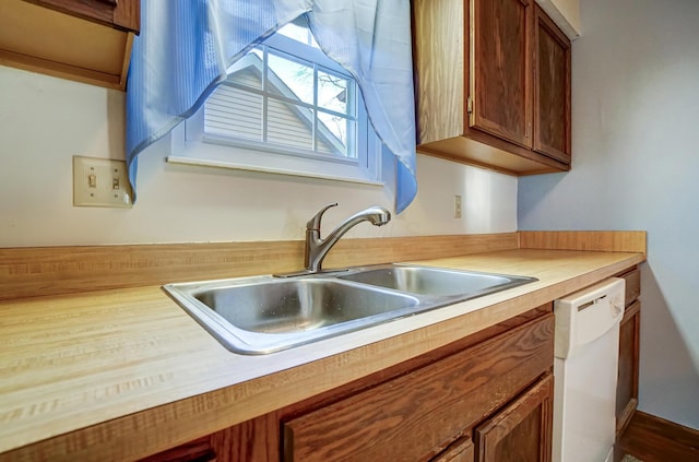 kitchen featuring dishwasher and sink