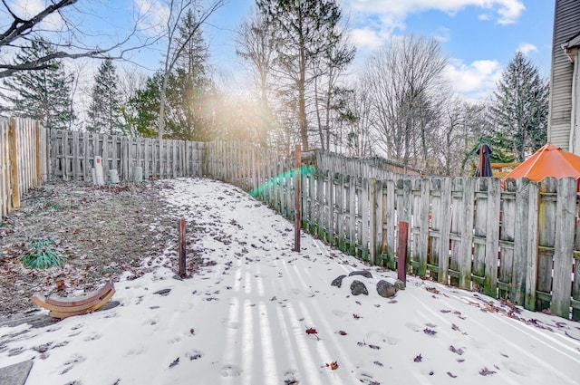 view of yard layered in snow