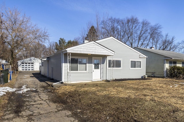 view of front facade with a garage and an outdoor structure