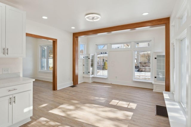 foyer entrance with light hardwood / wood-style floors