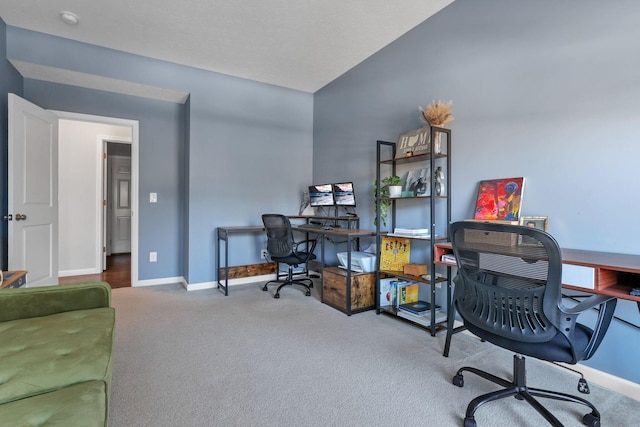 office area with lofted ceiling and carpet floors