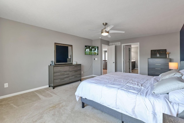 carpeted bedroom with a textured ceiling and ceiling fan