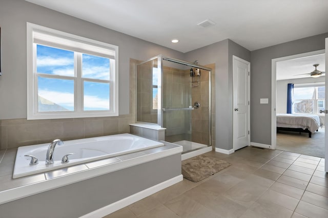 bathroom featuring ceiling fan, independent shower and bath, and tile patterned flooring