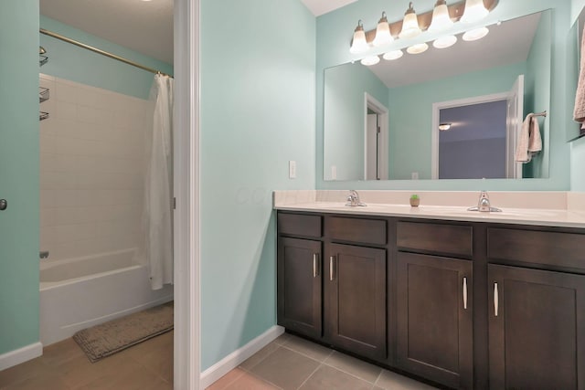 bathroom featuring tile patterned flooring, vanity, and shower / tub combo