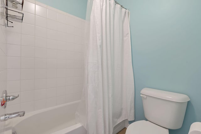 bathroom with toilet and shower / bath combo