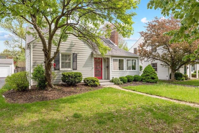 view of front of property with a chimney and a front yard