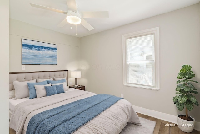 bedroom featuring ceiling fan and wood-type flooring