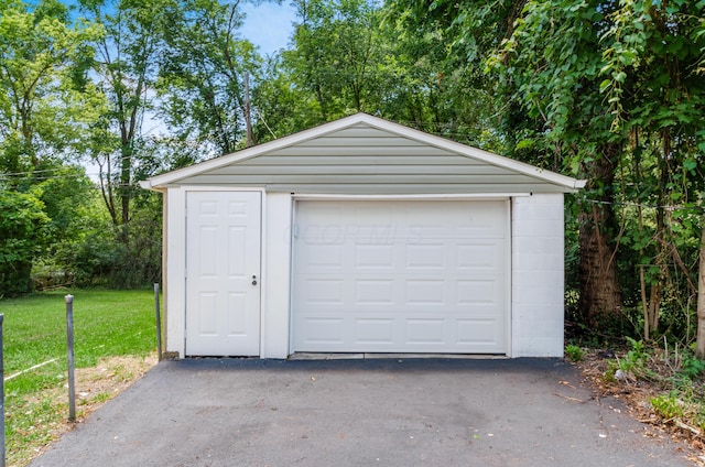 garage with a lawn