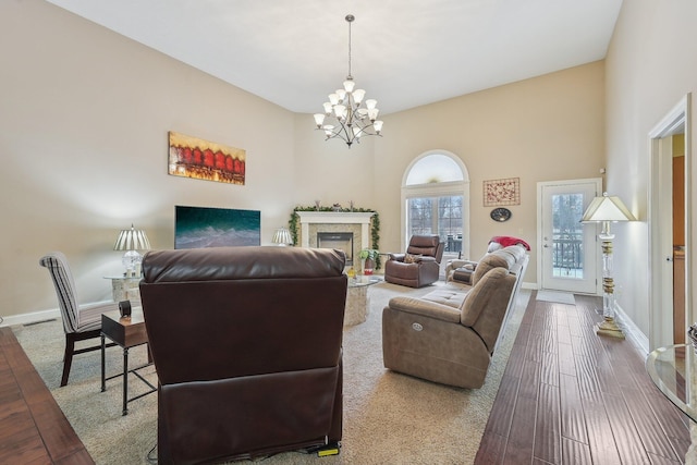 living room featuring an inviting chandelier and hardwood / wood-style floors