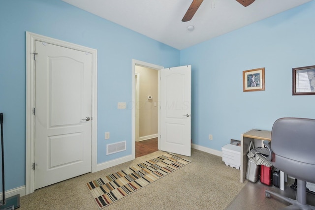 home office with carpet and ceiling fan