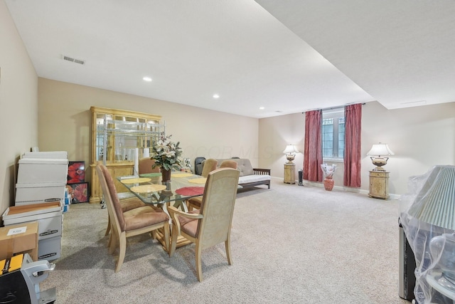 dining space with light carpet