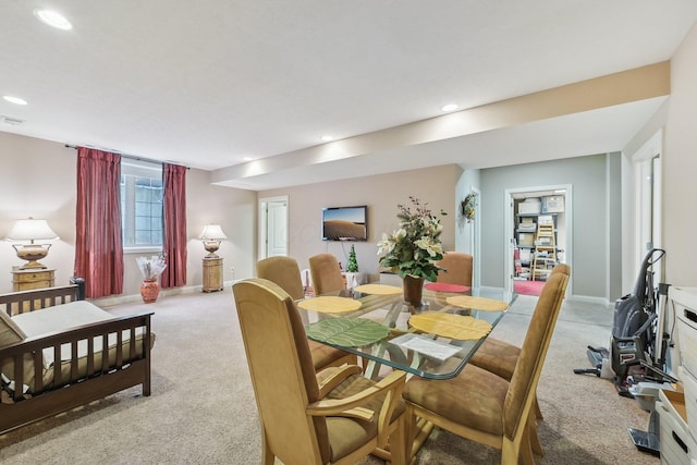 view of carpeted dining space