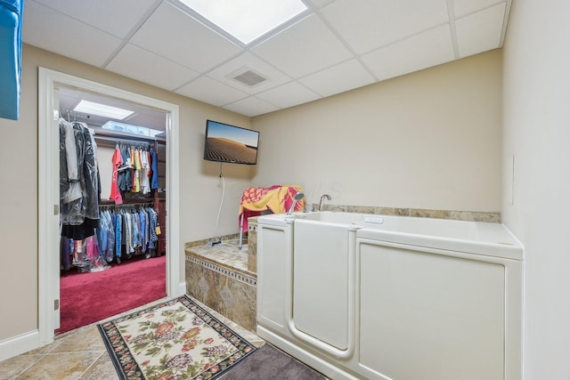 washroom with light colored carpet