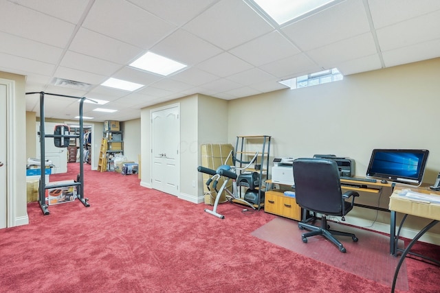 carpeted office space featuring a drop ceiling