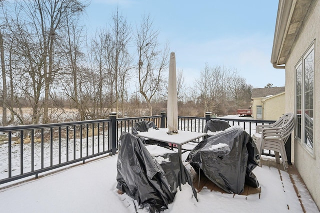 wooden balcony featuring grilling area and a deck