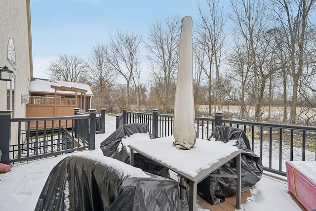 view of snow covered deck