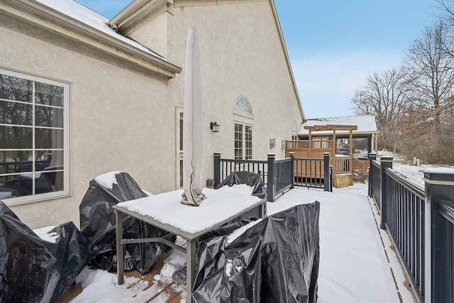 view of snow covered deck