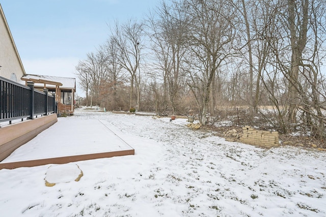 view of yard layered in snow