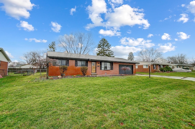 ranch-style home with a garage and a front lawn