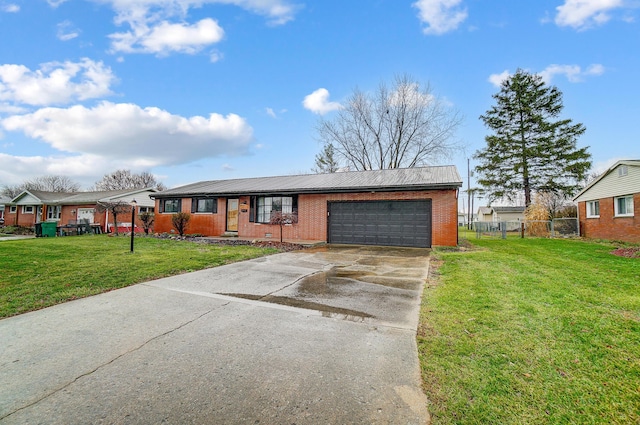 view of front of home featuring a garage and a front yard