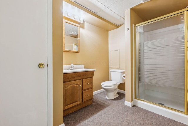 bathroom featuring vanity, a shower with door, and toilet