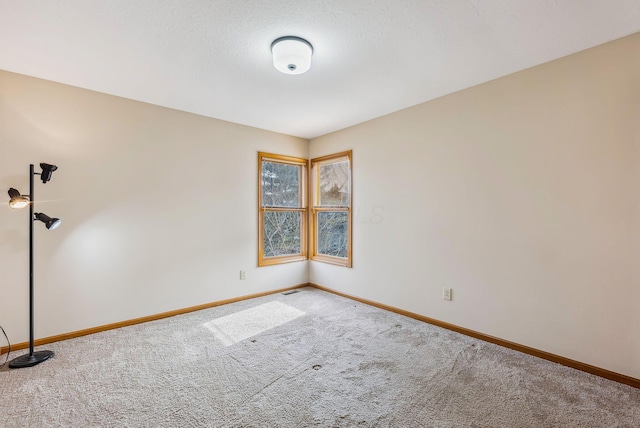 empty room featuring carpet flooring