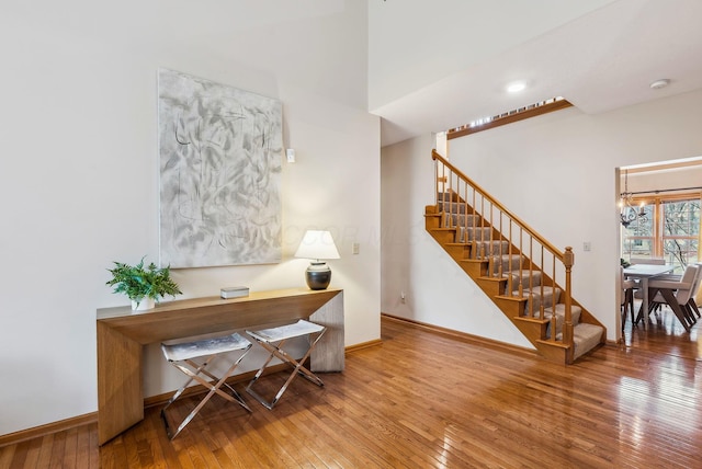 office space featuring hardwood / wood-style flooring and a chandelier