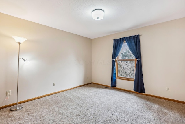 empty room featuring carpet flooring