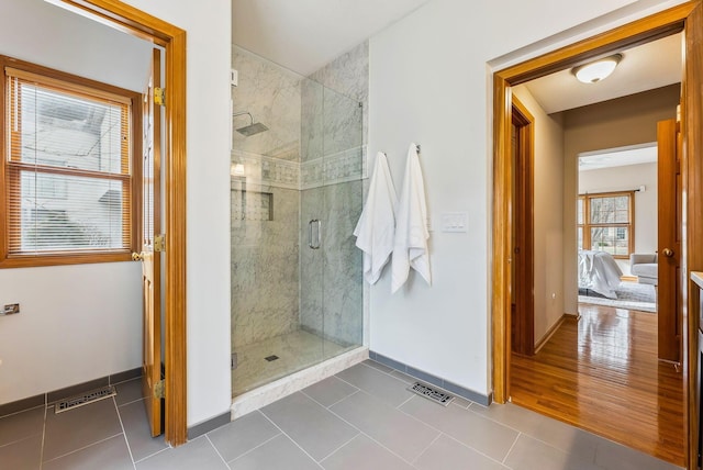 bathroom featuring tile patterned flooring and walk in shower