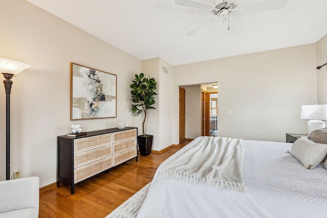 bedroom featuring wood-type flooring and ceiling fan