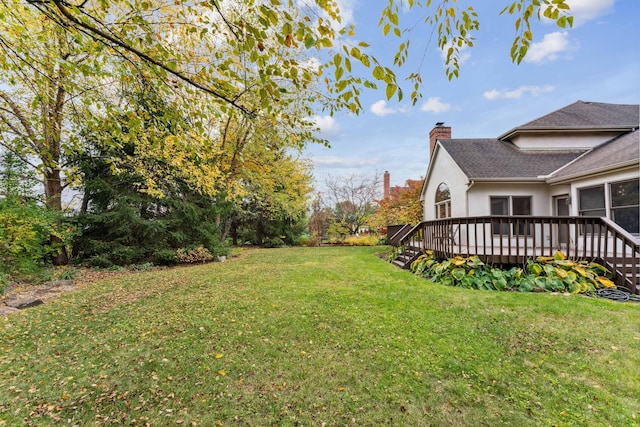 view of yard with a wooden deck