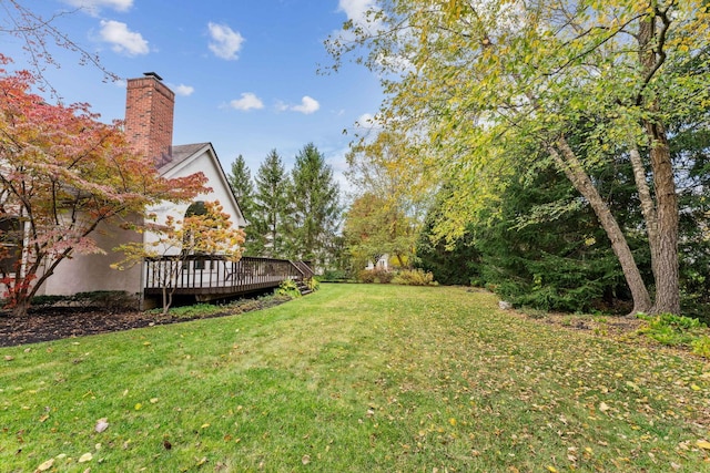 view of yard with a deck