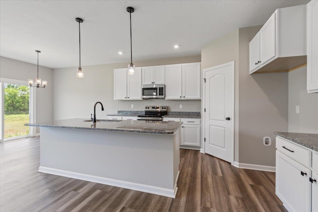 1233 Heathgate Way, Fairborn, OH 45324 - kitchen with appliances with stainless steel finishes, dark wood-type flooring, white cabinets, recessed lighting, and dark stone counters