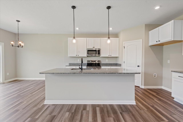 1233 Heathgate Way, Fairborn, OH 45324 - kitchen with stainless steel appliances, wood finished floors, stone counters, and recessed lighting