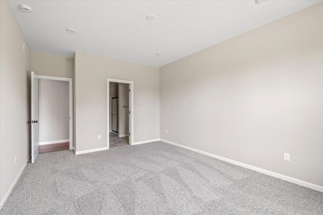 1233 Heathgate Way, Fairborn, OH 45324 - unfurnished bedroom with carpet flooring and baseboards