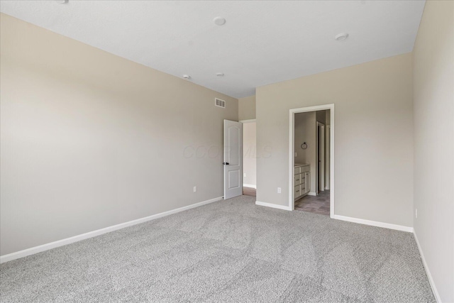1233 Heathgate Way, Fairborn, OH 45324 - unfurnished bedroom featuring light carpet and ensuite bath