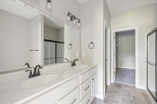 1233 Heathgate Way, Fairborn, OH 45324 - bathroom featuring a stall shower, a walk in closet, and double vanity