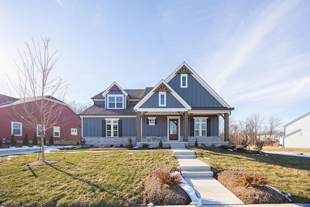 view of front facade with a front yard and a porch